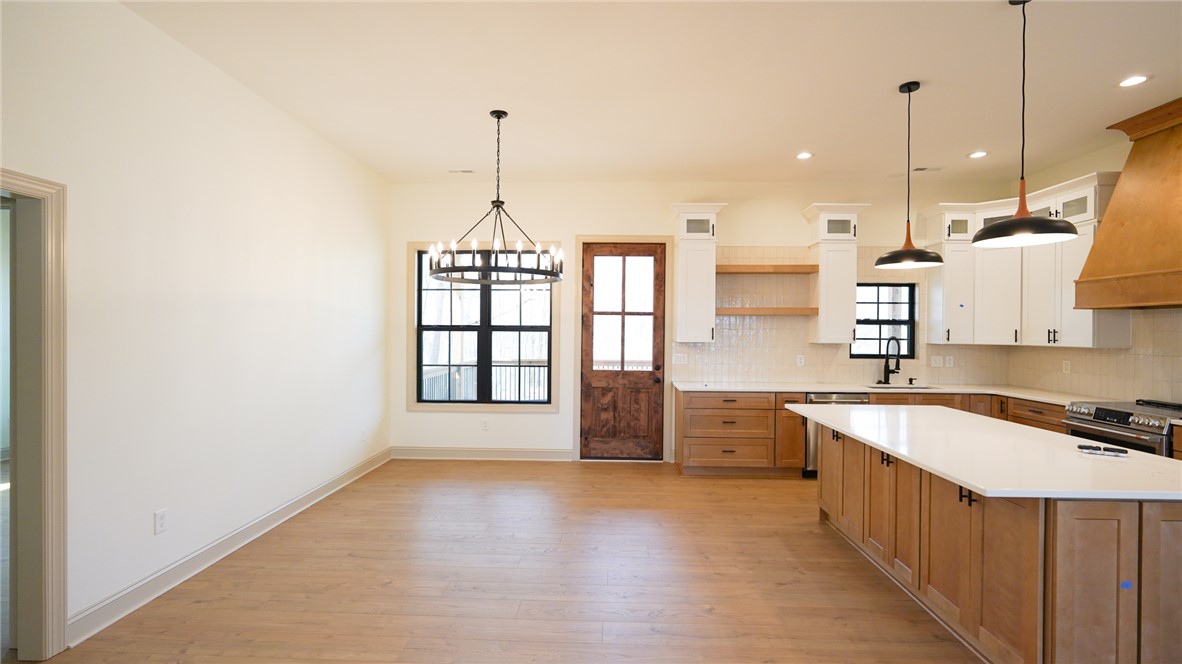 1001 Five Forks Road Pendleton, SC 29670 - Photo 10 of 43 This bright, open kitchen and dining area features modern fixtures and sleek finishes.