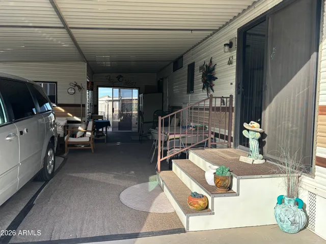 a view of a porch with furniture and a flat screen tv