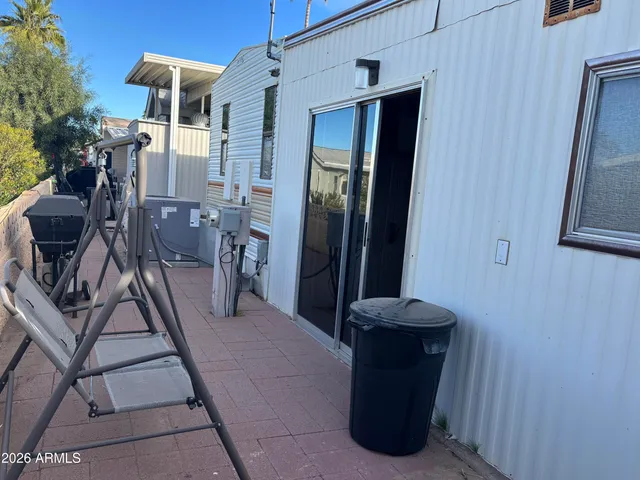 a view of a hallway with seating area