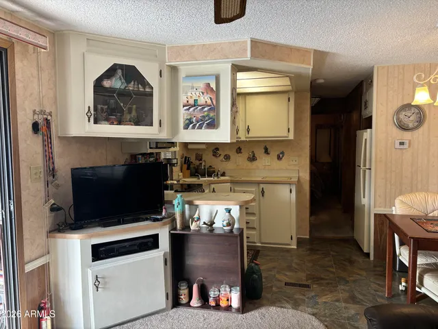 a view of a livingroom with furniture and a fireplace