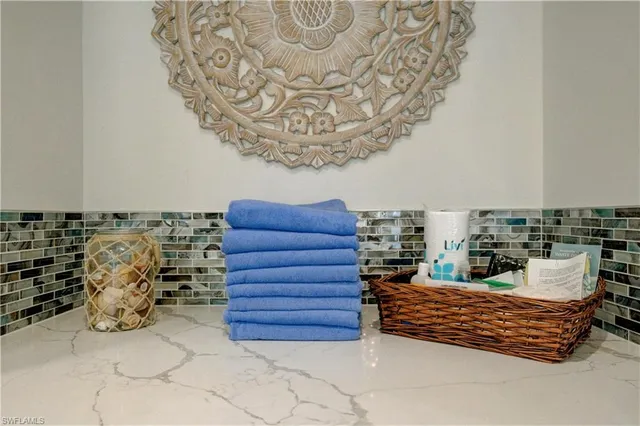 a view of a room with a table and chairs in patio
