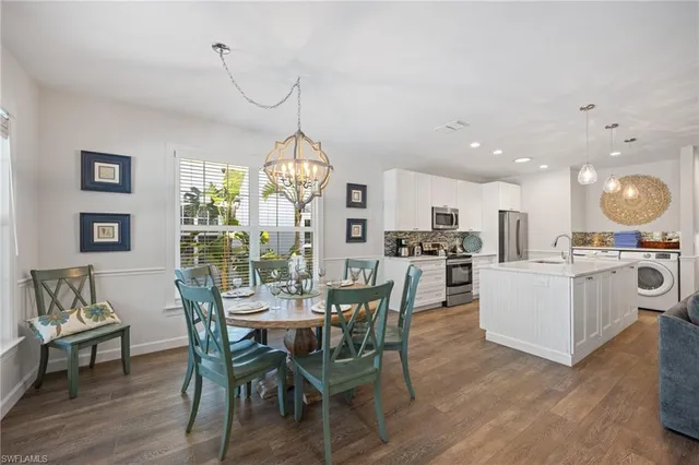 a bedroom with bed window and wooden floor