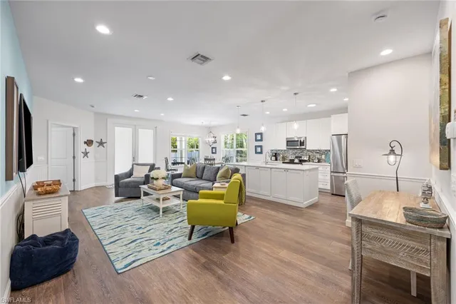 a living room with fireplace furniture and a flat screen tv