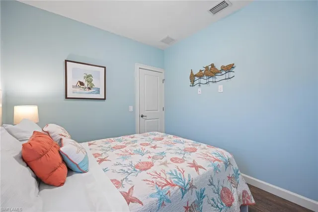 a bed room with two beds and a window