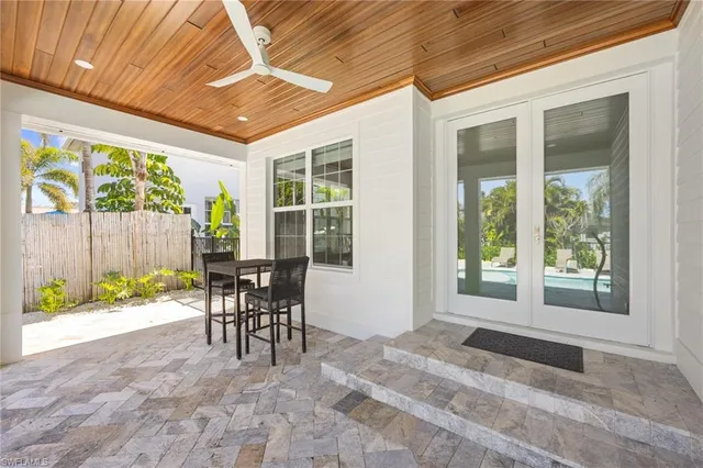 a view of a chair and table in backyard