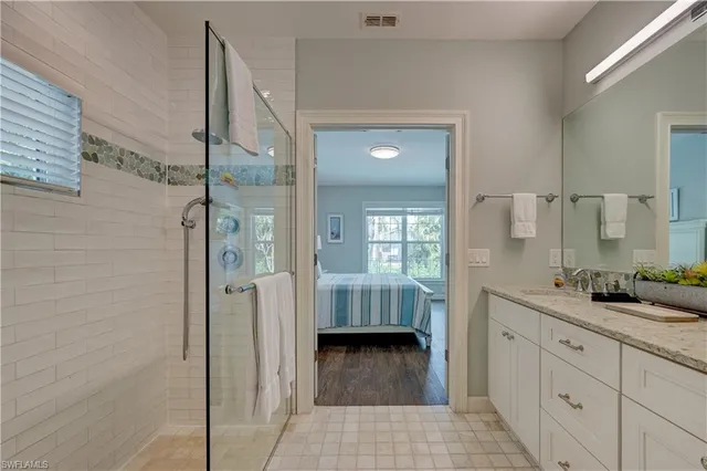a en suite bathroom with a sink and a mirror