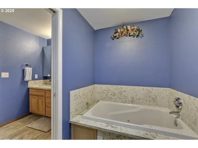 a bathroom with a tub and sink