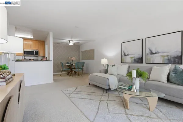a kitchen with granite countertop a sink stainless steel appliances a counter space and cabinets