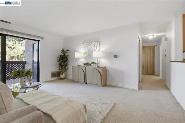 a view of a car park in front of a house