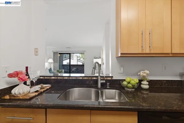 a bedroom with a bed and a night stand