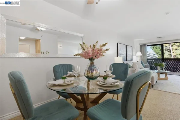 a view of a big room with brick walls and a large tree