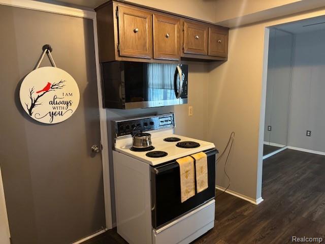 31056 Richert Street, Unit 8 Fraser, MI 48026 - Photo 10 of 19 Kitchen featuring electric range and microwave.