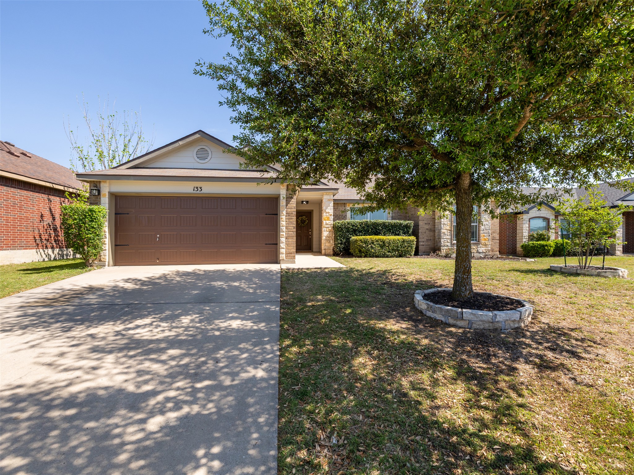 Welcoming single-story facade showcasing fresh exterior paint, manicured landscaping, and a charming entryway that sets the tone for this move-in ready home.