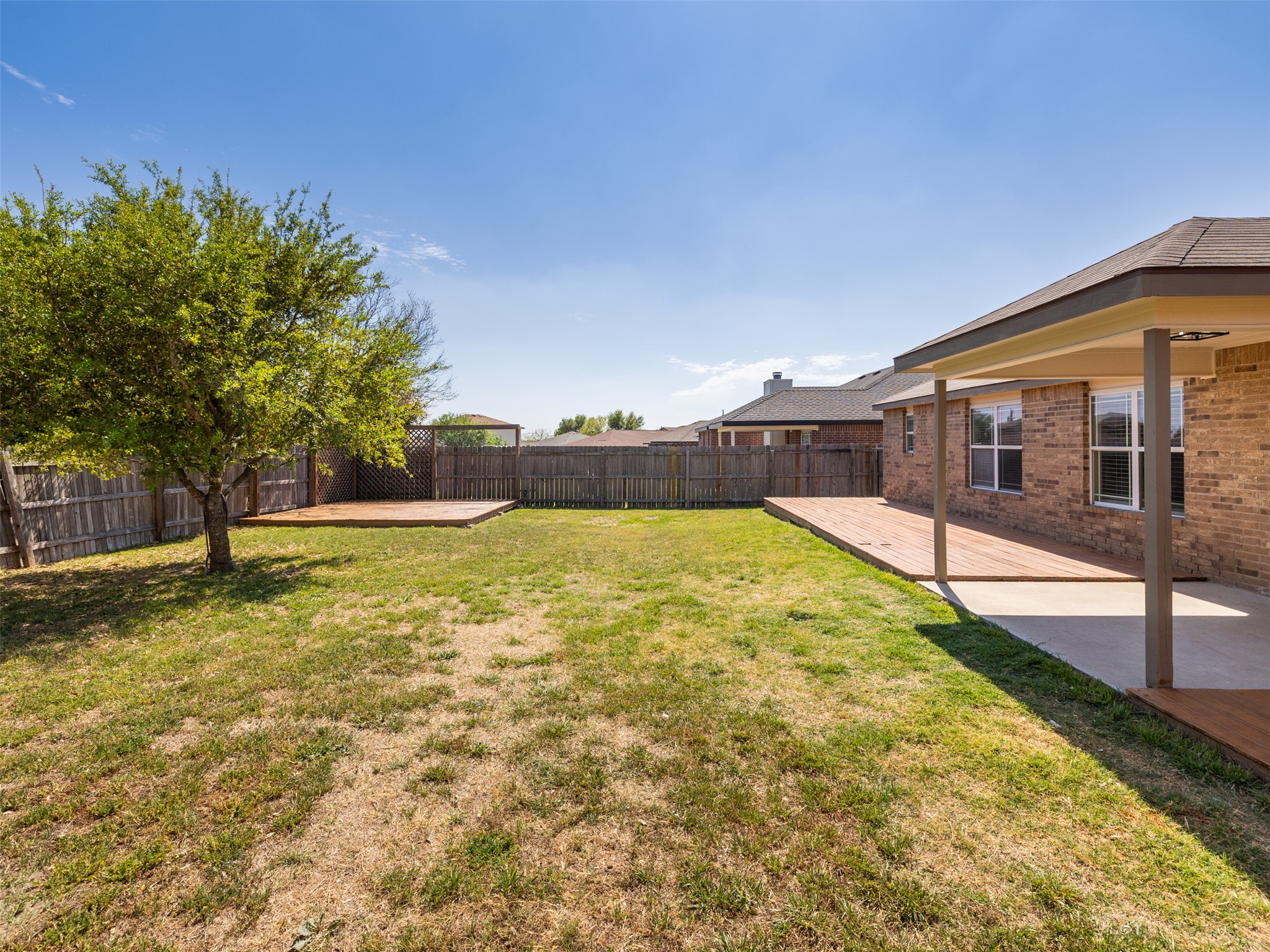 133 Lignite Drive Jarrell, TX 76537 - Photo 19 of 36 The fully fenced backyard provides privacy and security — a safe space for kids, pets, and weekend gatherings alike.