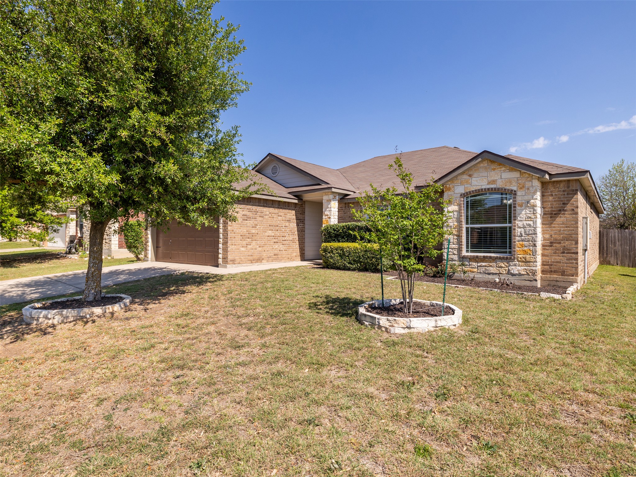 133 Lignite Drive Jarrell, TX 76537 - Photo 2 of 36 The updated exterior paint and well-maintained landscaping set the tone for the care and attention found throughout this home.
