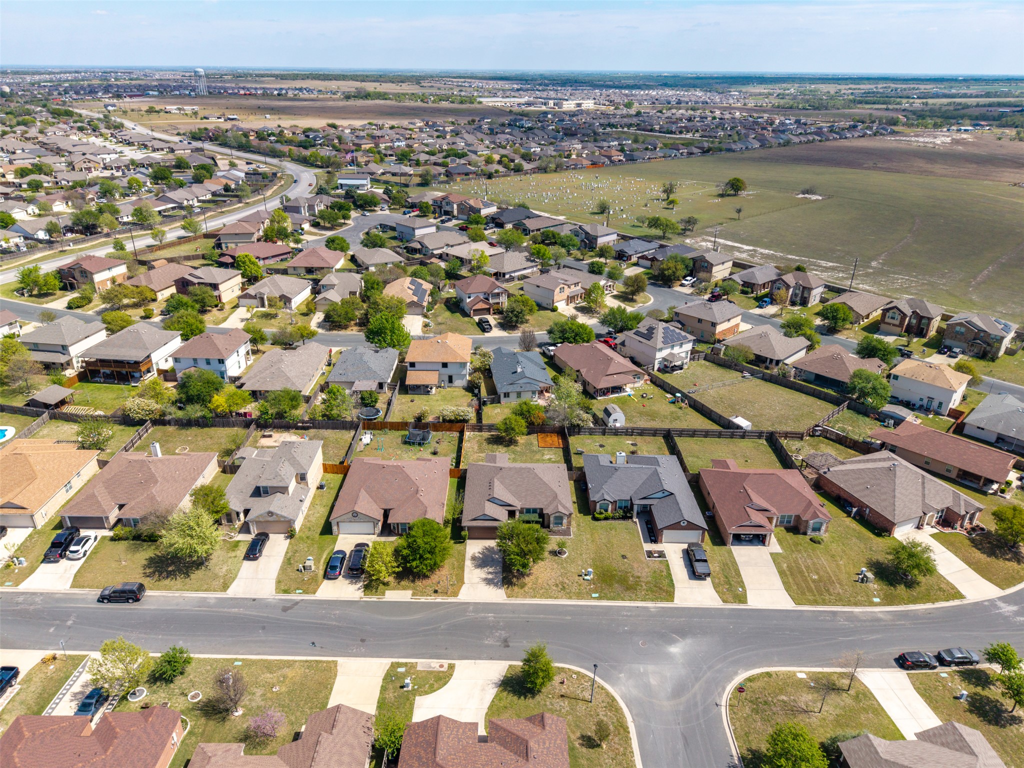 133 Lignite Drive Jarrell, TX 76537 - Photo 28 of 36 The neighborhood streets are clean and well-maintained, reflecting the pride of ownership throughout the Sonterra community.