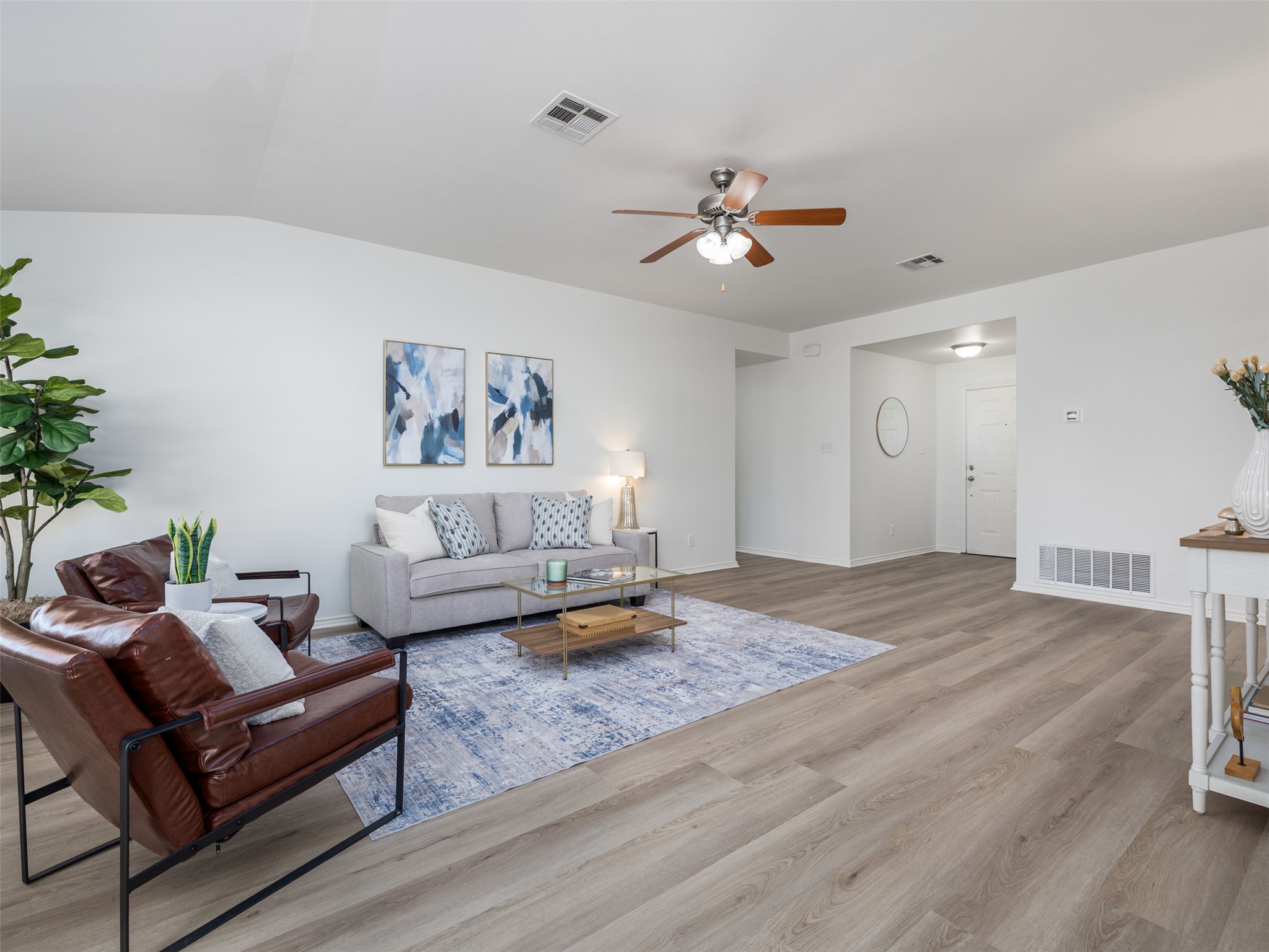 133 Lignite Drive Jarrell, TX 76537 - Photo 5 of 36 Natural light pours into the living room creating a warm, inviting atmosphere perfect for relaxing or entertaining.
