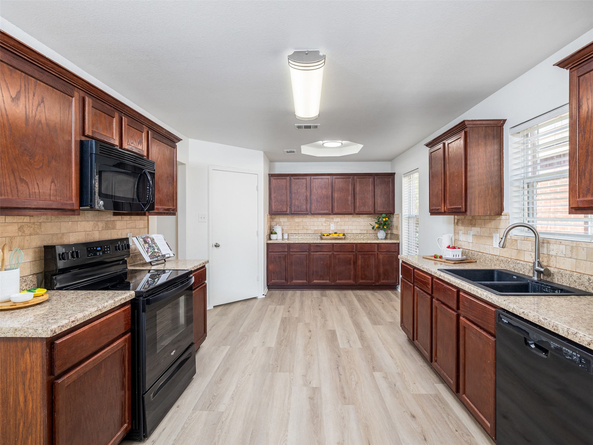 133 Lignite Drive Jarrell, TX 76537 - Photo 8 of 36 Abundant storage throughout the kitchen keeps everything organized and within easy reach.