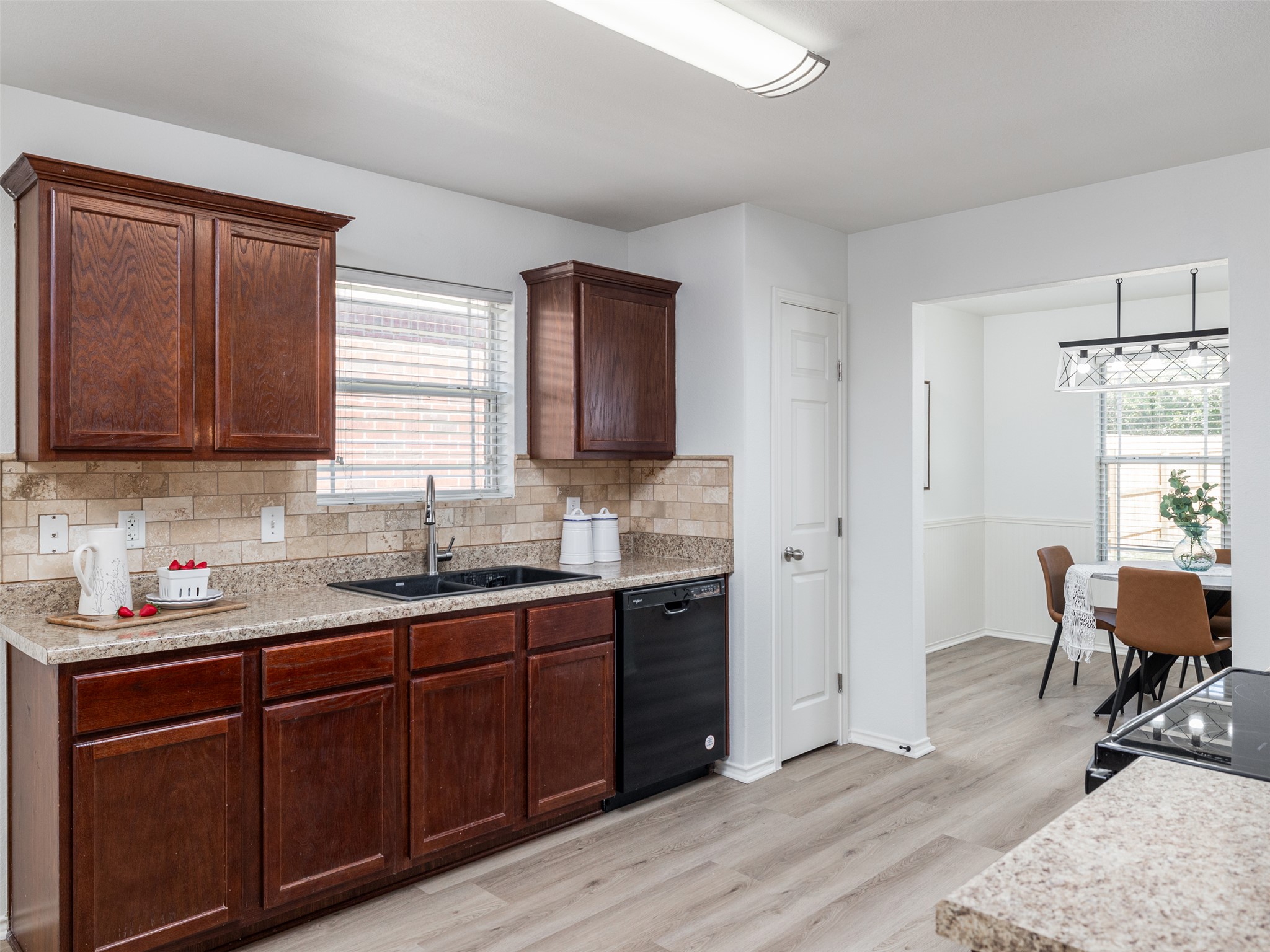 133 Lignite Drive Jarrell, TX 76537 - Photo 9 of 36 Natural light fills the kitchen, making it a bright and enjoyable space to cook and gather in.