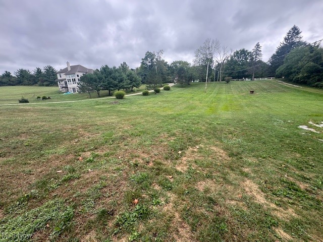 5210 Blair Road Perry, OH 44081 - Photo 11 of 11 View of grassy yard with view of wooded area