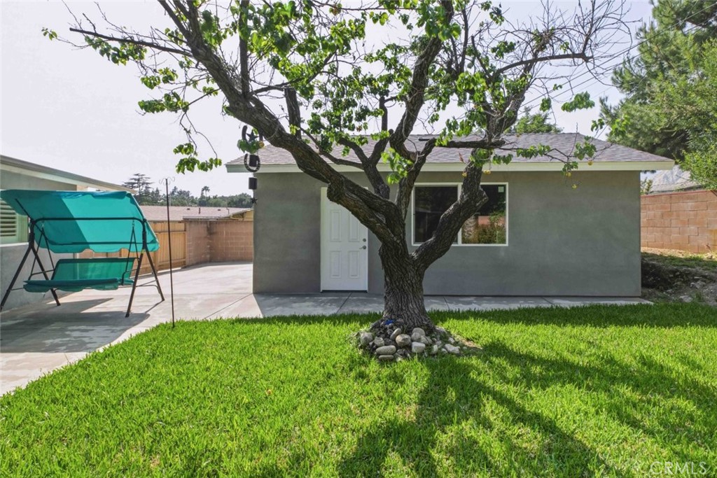 301 West Ashby Street Azusa, CA 91702 - Photo 36 of 75 a view of a house with a yard and sitting area