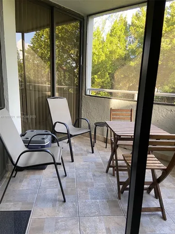 a view of a house with a yard and plants