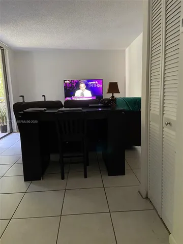 a work room with furniture and a window