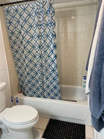 a bedroom with a bed and a stove