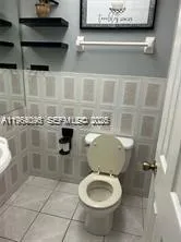 a bathroom with a toilet and a sink