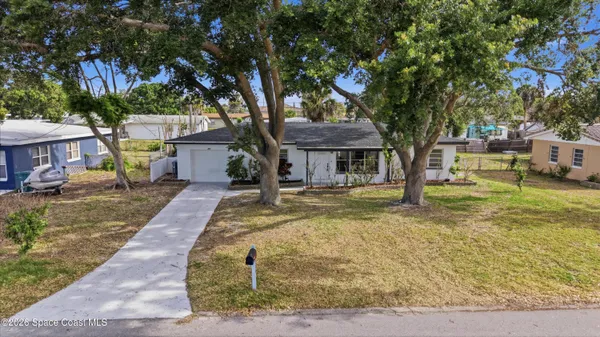 a house with trees in front of it