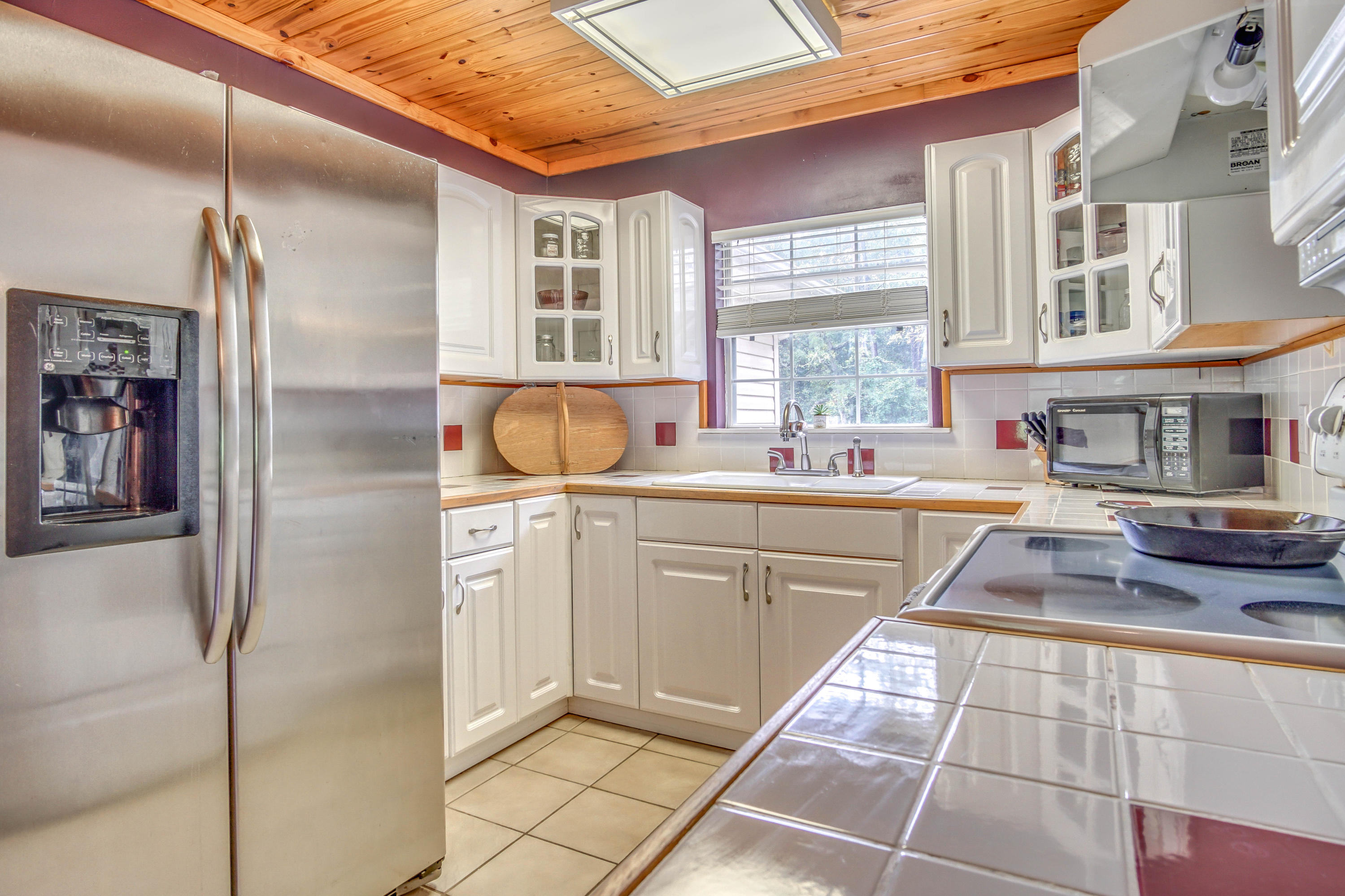 3110 Bay Ridge Drive Crestview, FL 32539 - Photo 19 of 31 a kitchen with stainless steel appliances granite countertop a sink and cabinets