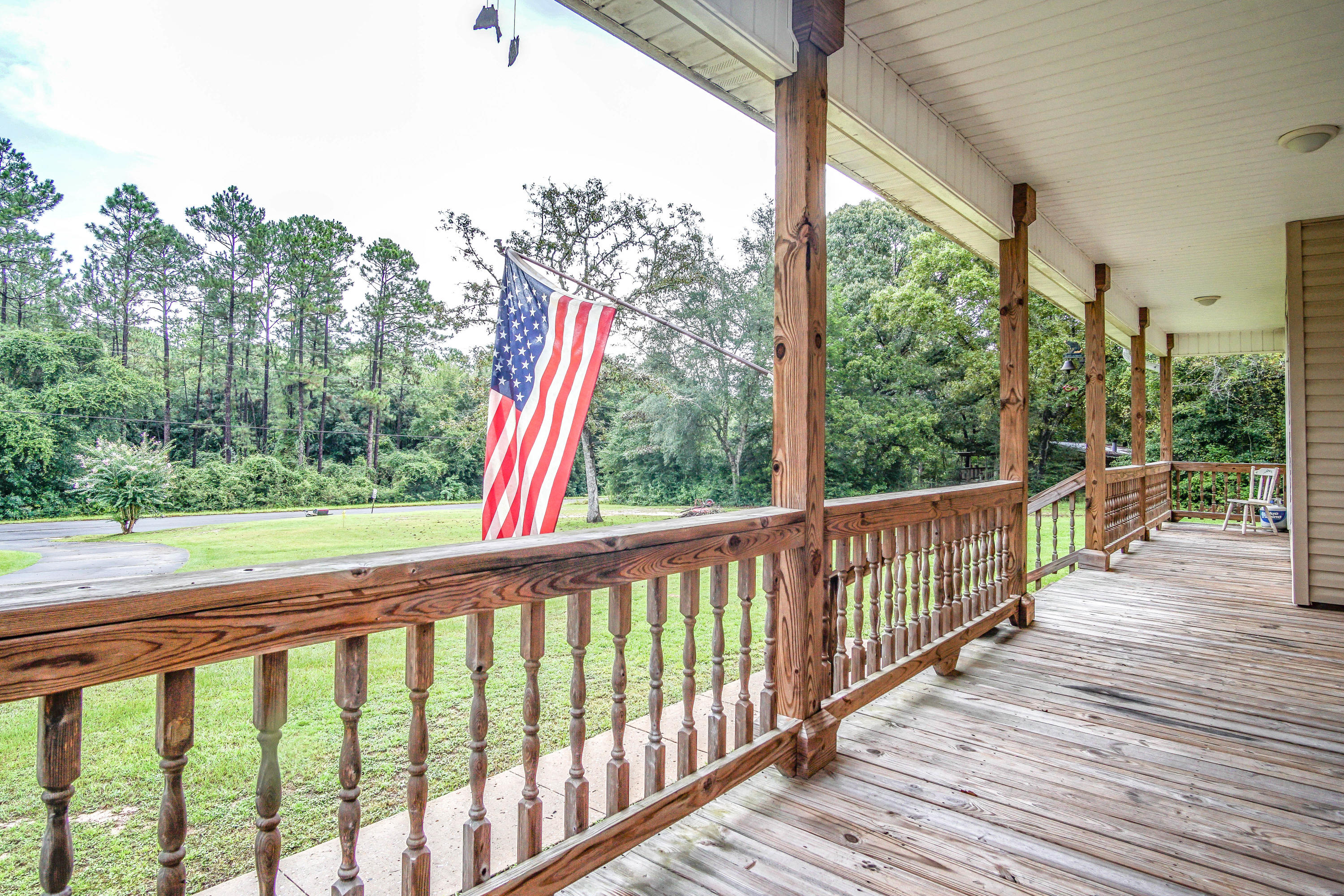 3110 Bay Ridge Drive Crestview, FL 32539 - Photo 4 of 31 a view of a wooden deck next to a yard