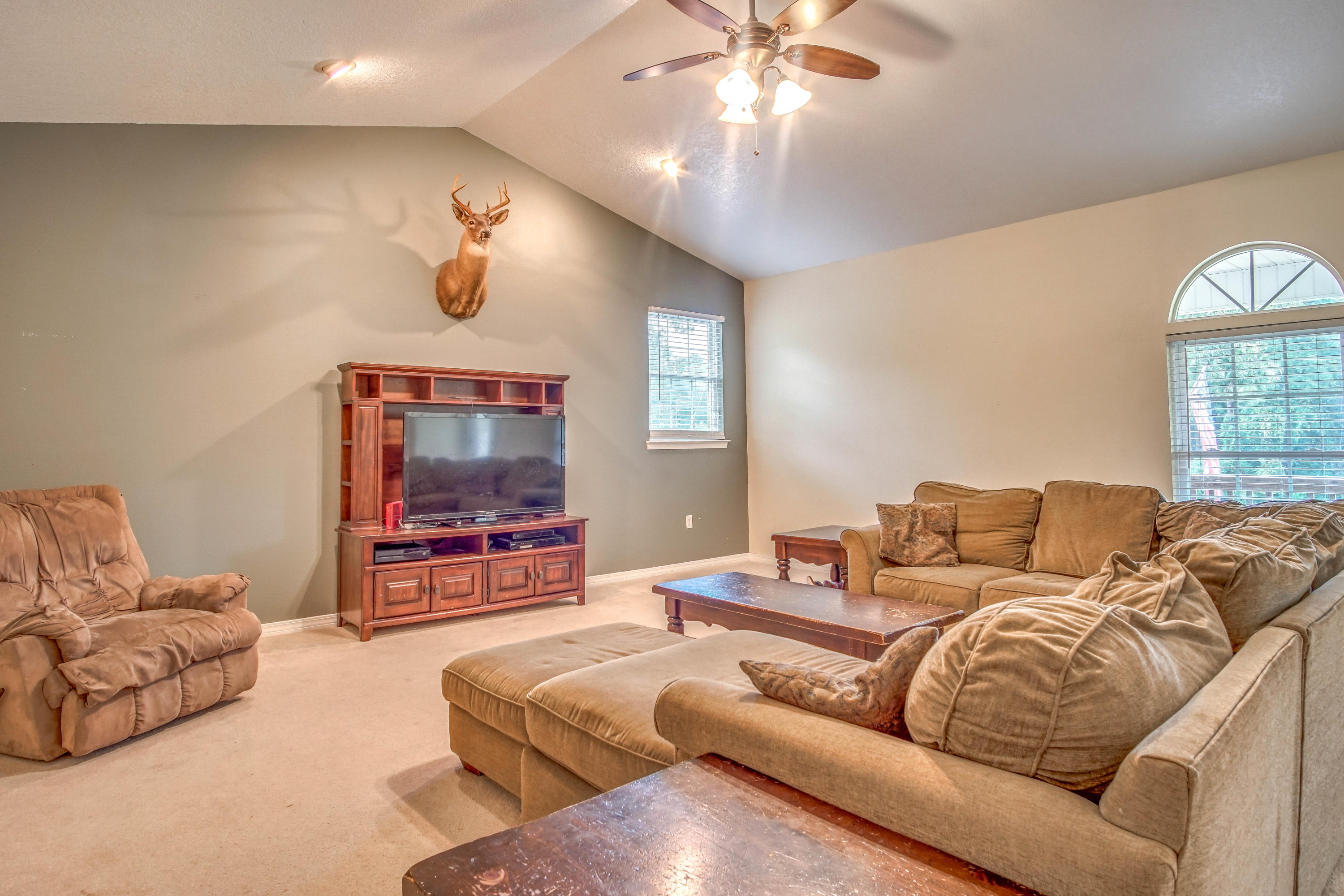 3110 Bay Ridge Drive Crestview, FL 32539 - Photo 8 of 31 a living room with furniture and a flat screen tv