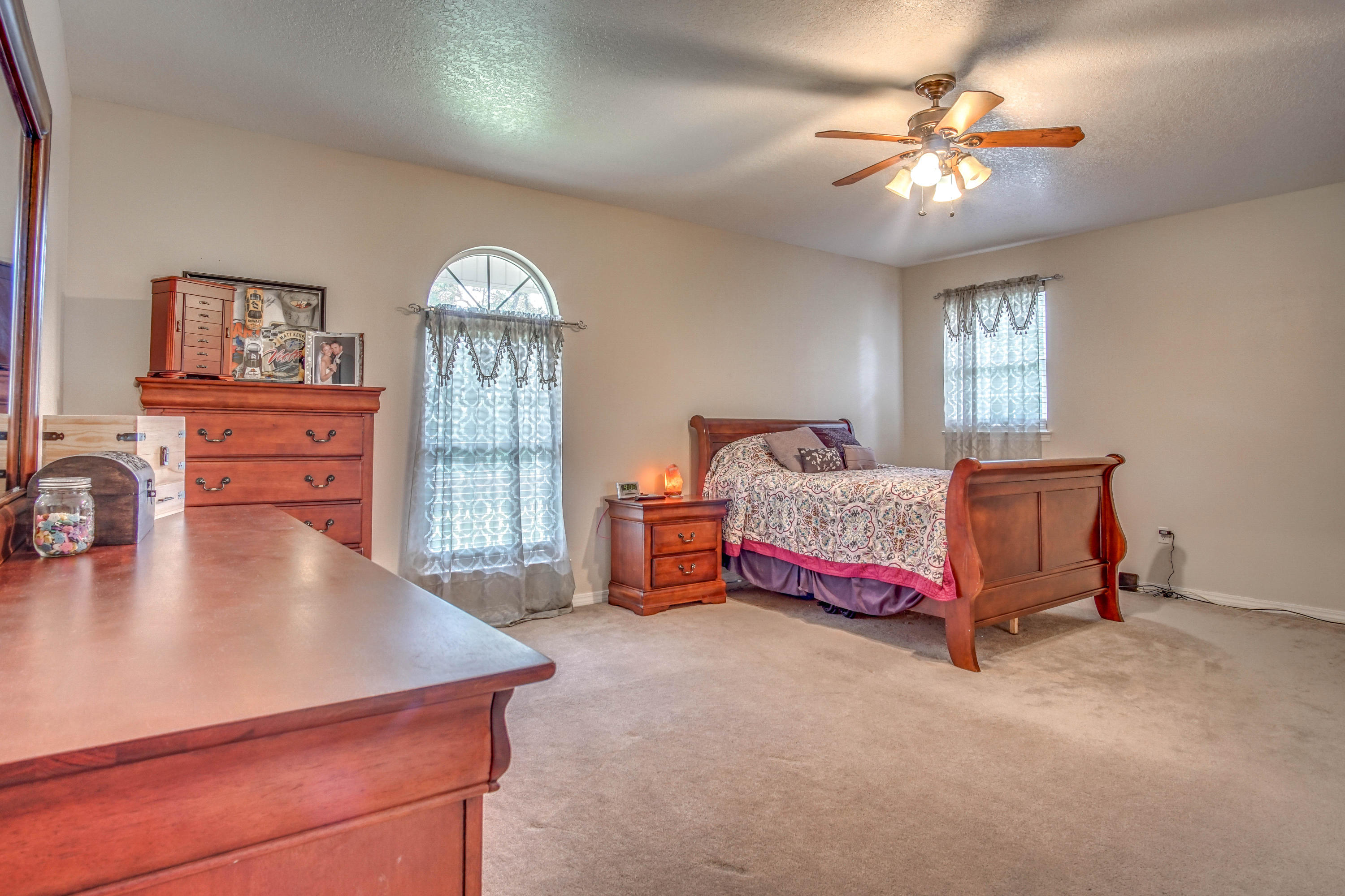 3110 Bay Ridge Drive Crestview, FL 32539 - Photo 9 of 31 a bed room with a bed and a chandelier