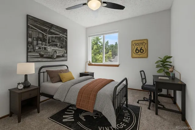 a bedroom with a bed and a table