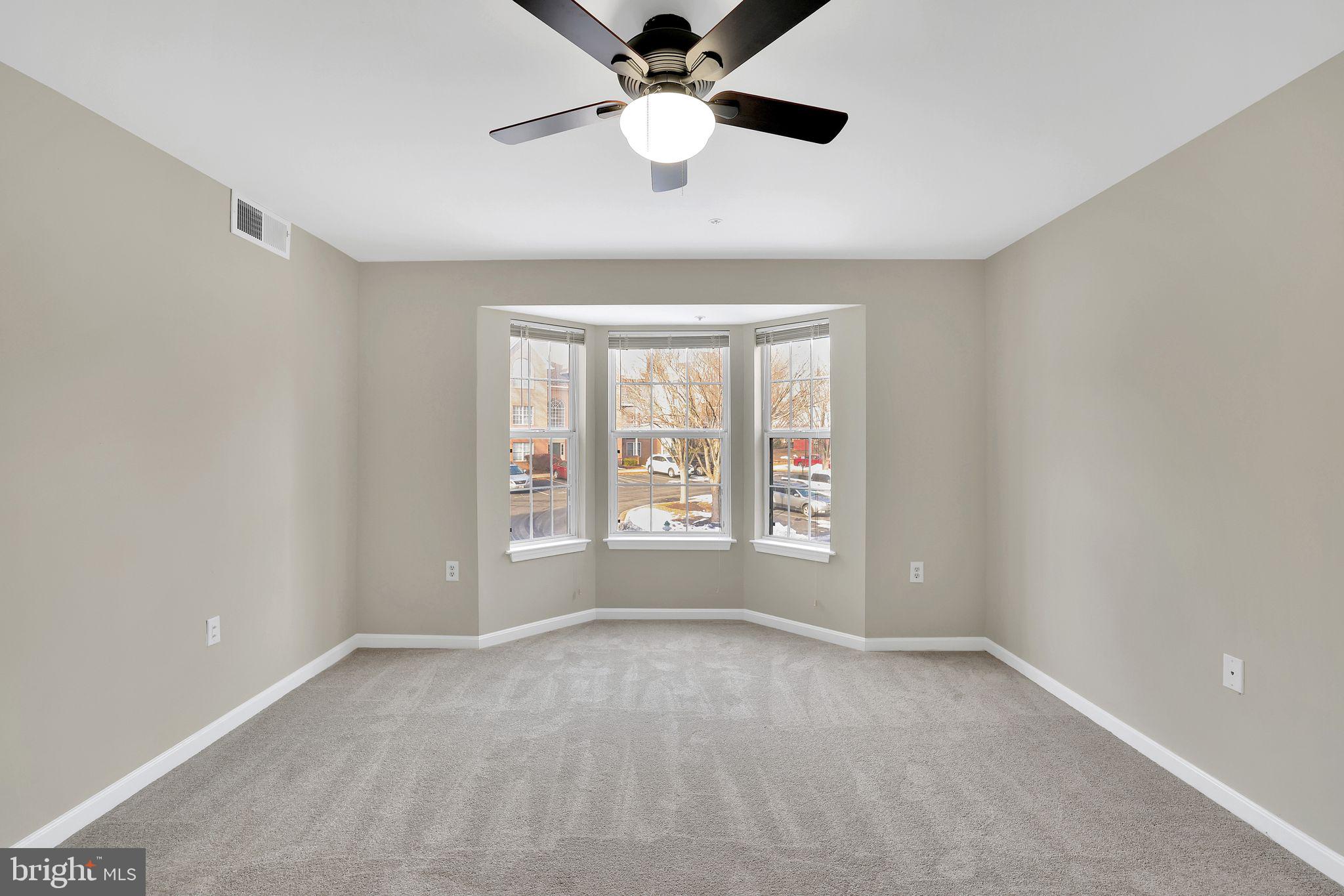 9808 Lake Pointe, Unit 201 Upper Marlboro, MD 20774 - Photo 16 of 25 a view of an empty room with a window