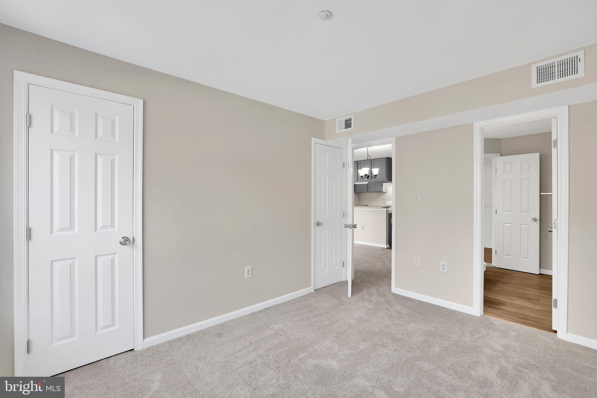 9808 Lake Pointe, Unit 201 Upper Marlboro, MD 20774 - Photo 20 of 25 a view of an empty room with closet and a window