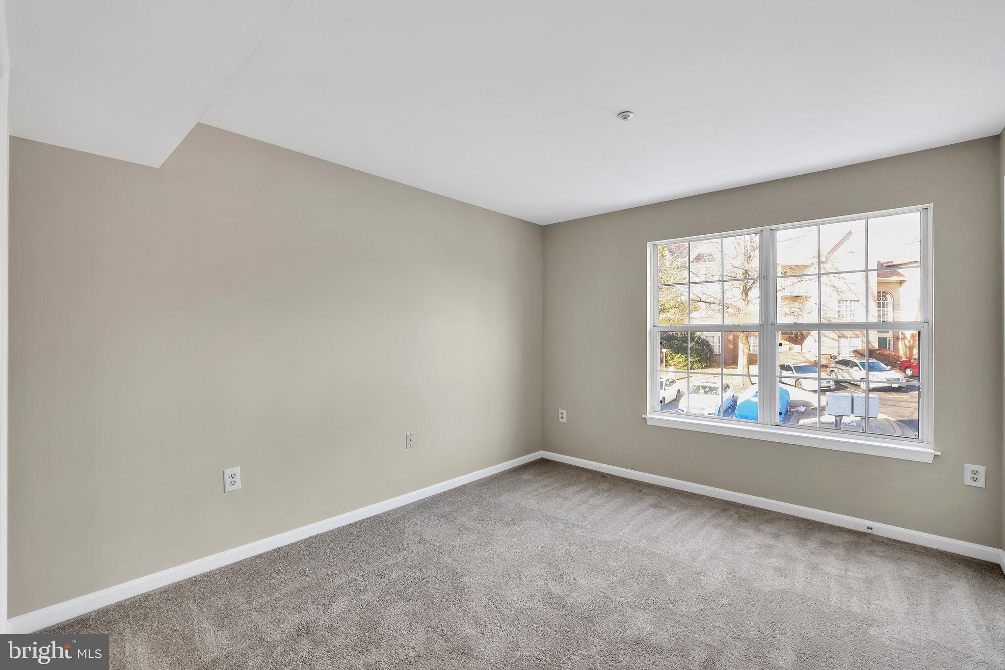 9808 Lake Pointe, Unit 201 Upper Marlboro, MD 20774 - Photo 21 of 25 an empty room with windows