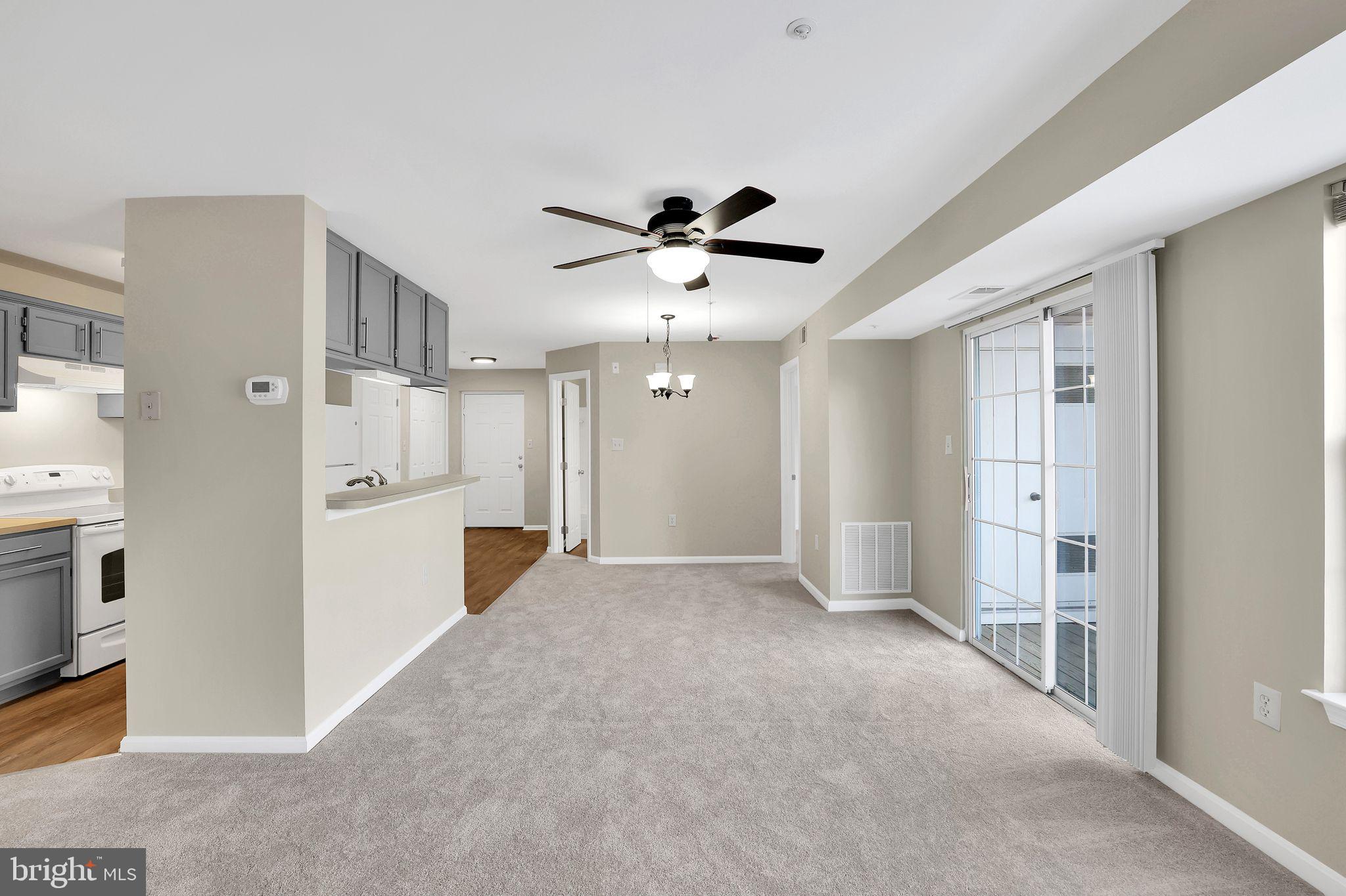 9808 Lake Pointe, Unit 201 Upper Marlboro, MD 20774 - Photo 4 of 25 a view of a kitchen with refrigerator and a sink