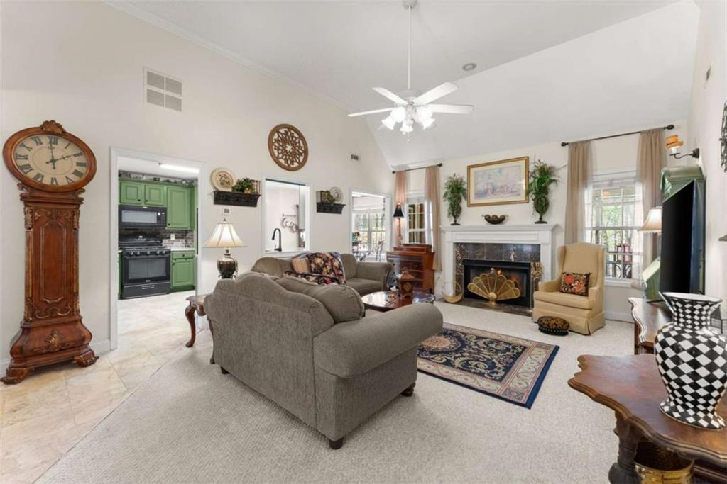 219 John Garner Road Dahlonega, GA 30533 - Photo 13 of 76 a living room with furniture a fireplace and a flat screen tv