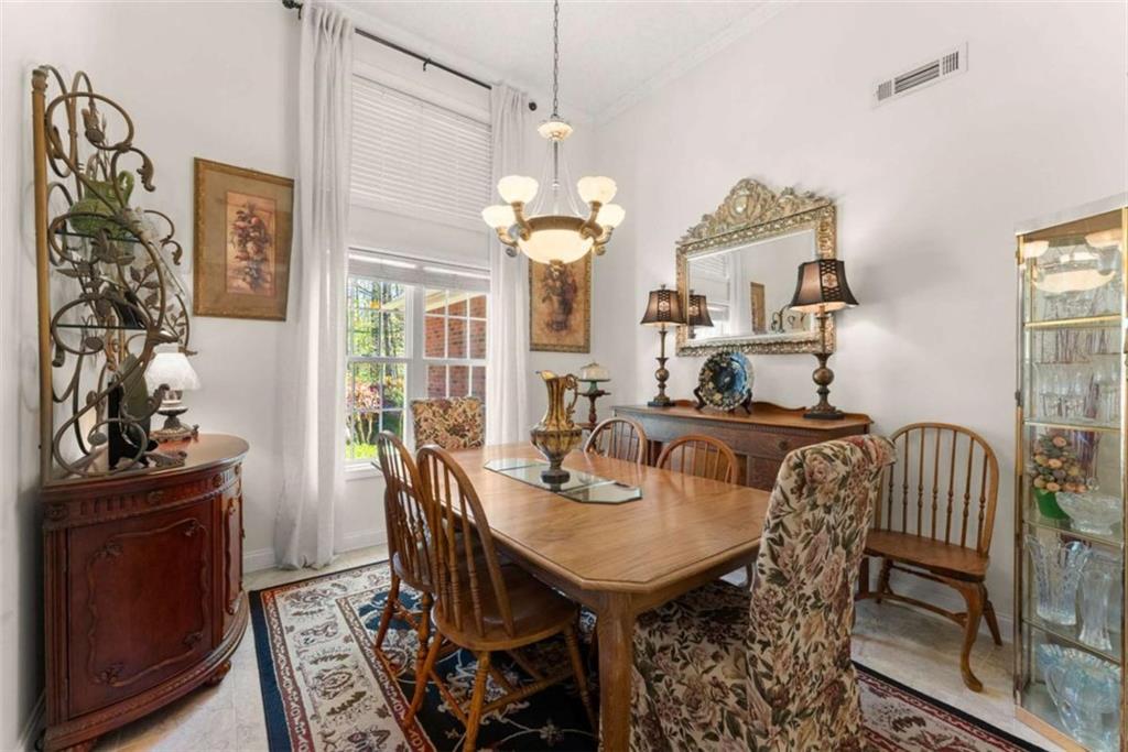 219 John Garner Road Dahlonega, GA 30533 - Photo 20 of 76 a view of a dining room with furniture and chandelier