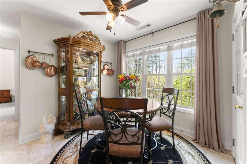 219 John Garner Road Dahlonega, GA 30533 - Photo 23 of 76 a view of a dining room with furniture window and outside view