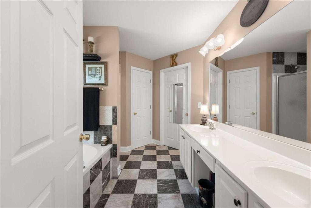 219 John Garner Road Dahlonega, GA 30533 - Photo 27 of 76 a room with a sink and a mirror