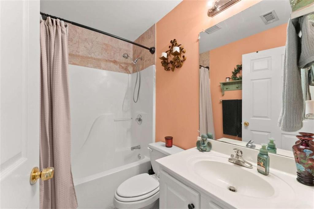 219 John Garner Road Dahlonega, GA 30533 - Photo 30 of 76 a bathroom with a sink toilet and shower
