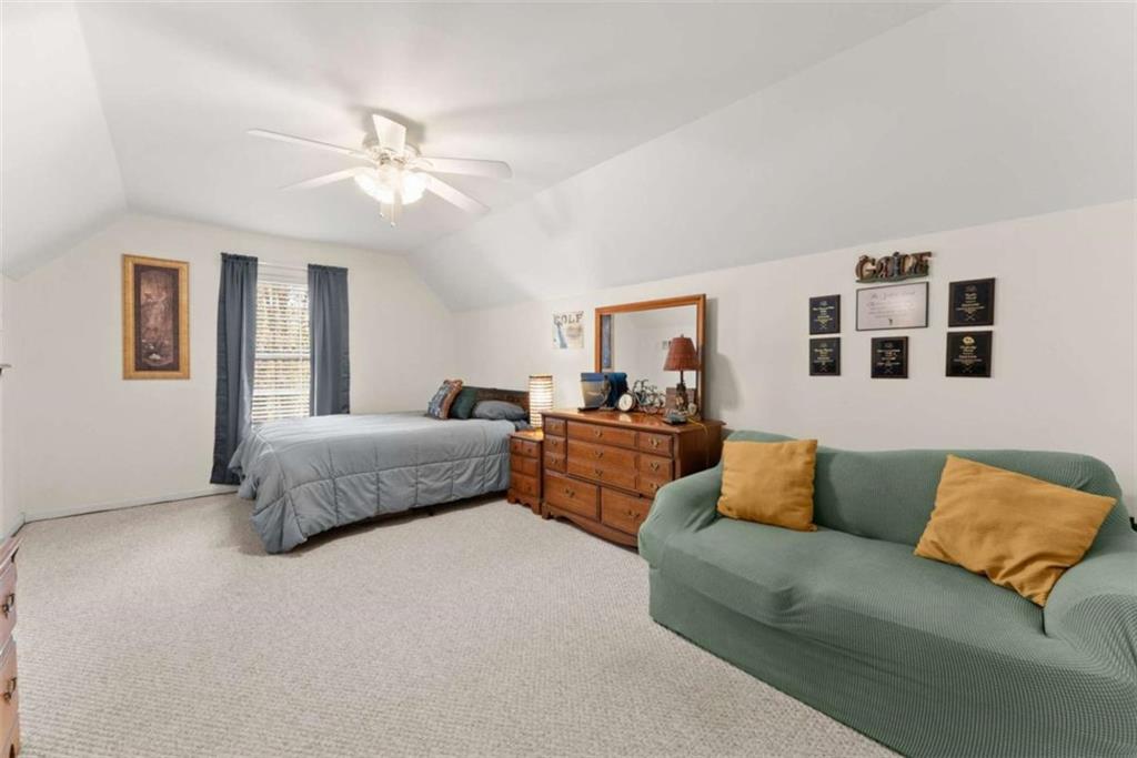 219 John Garner Road Dahlonega, GA 30533 - Photo 35 of 76 a bedroom with a bed couch and window