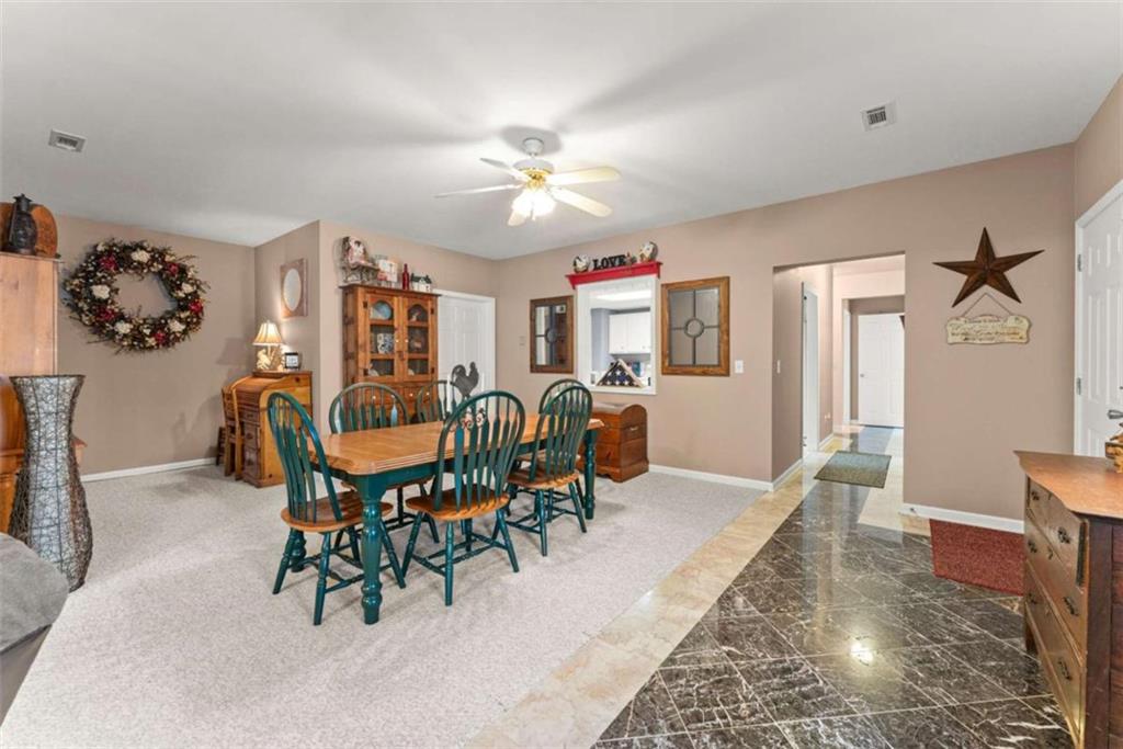219 John Garner Road Dahlonega, GA 30533 - Photo 52 of 76 a view of a dining room with furniture and chandelier