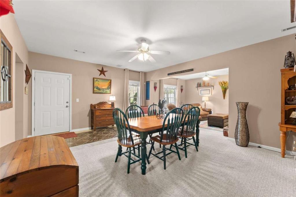 219 John Garner Road Dahlonega, GA 30533 - Photo 53 of 76 a view of a dining room with furniture and chandelier