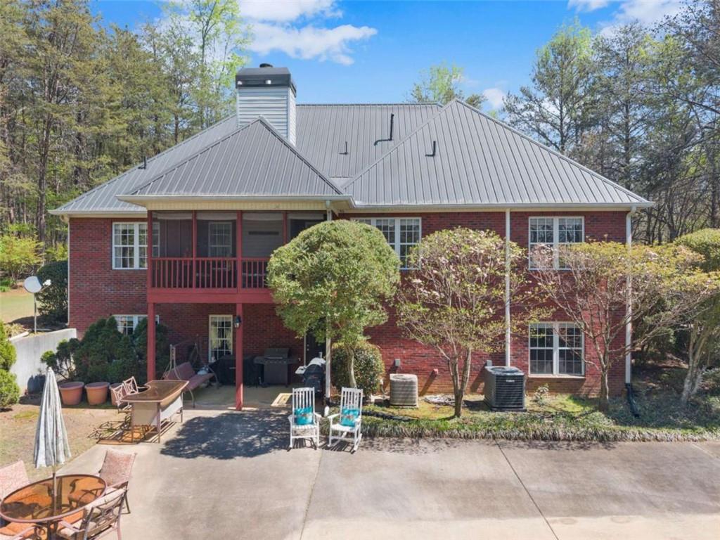 219 John Garner Road Dahlonega, GA 30533 - Photo 65 of 76 a front view of a house with garden