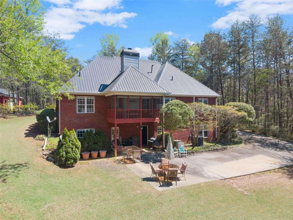 219 John Garner Road Dahlonega, GA 30533 - Photo 67 of 76 a front view of a house with patio