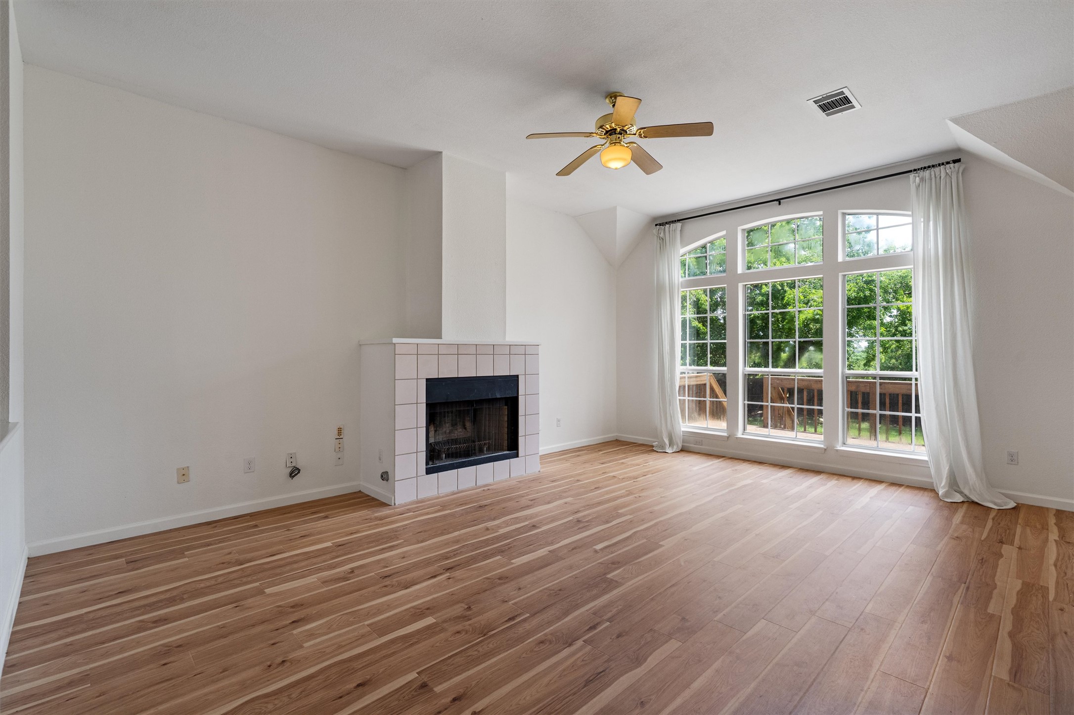 100 Parque Circle Georgetown, TX 78626 - Photo 8 of 39 a view of empty room with wooden floor and fan